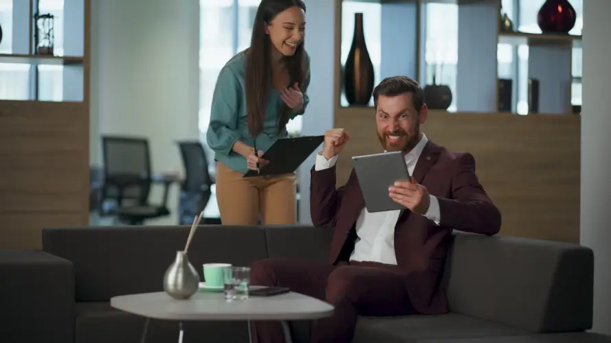 excited-partners-winning-deal-cheering-cabinet-cheerful-pair-looking-tablet.jpg