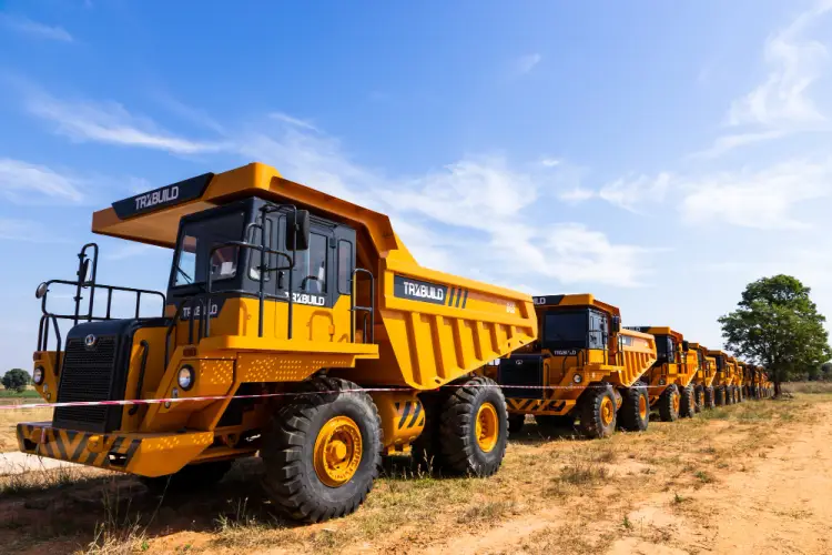 yellow-dump-trucks-fleet-construction-site.jpg