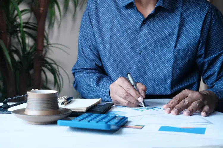 man-analyzing-tax-documents-at-desk.jpg