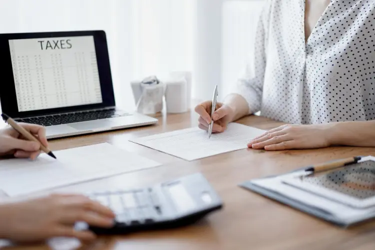team-working-together-on-tax-documents.jpg