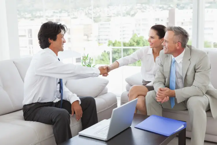 business-handshake-laptop-meeting-room.jpg