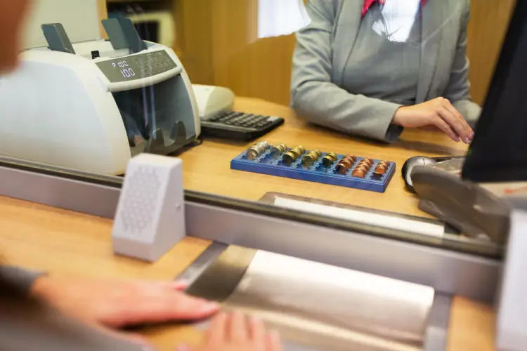 bank-teller-counting-coins.jpg
