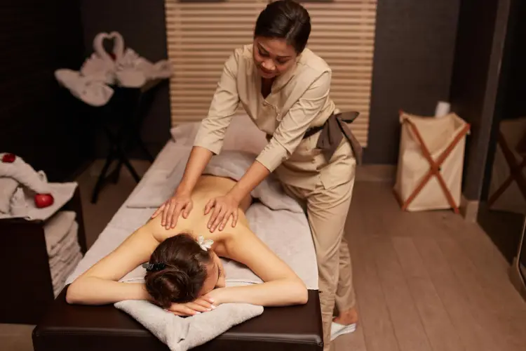 asian-therapist-giving-back-massage.jpg