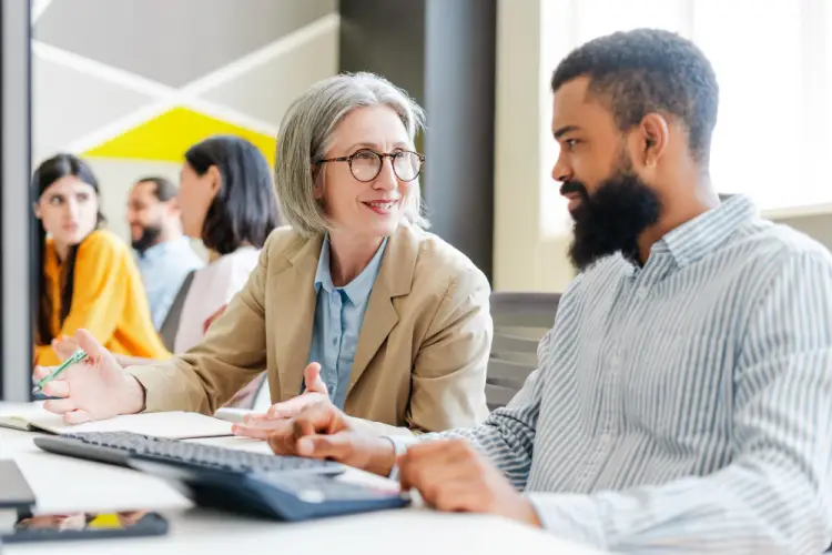 mature-consultant-giving-guidance-to-client.jpg