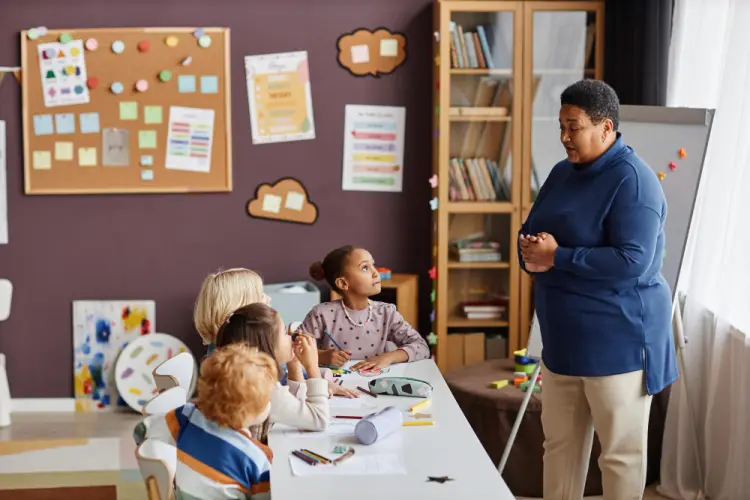 teacher-speaking-to-classroom-of-kids.jpg