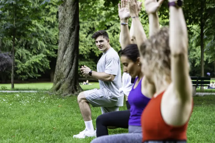 young-ladies-working-out-with-their-fitness-coach-park-munich.jpg