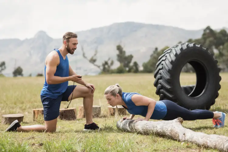 bootcamp-trainer-coaching-pushups-outdoors.jpg