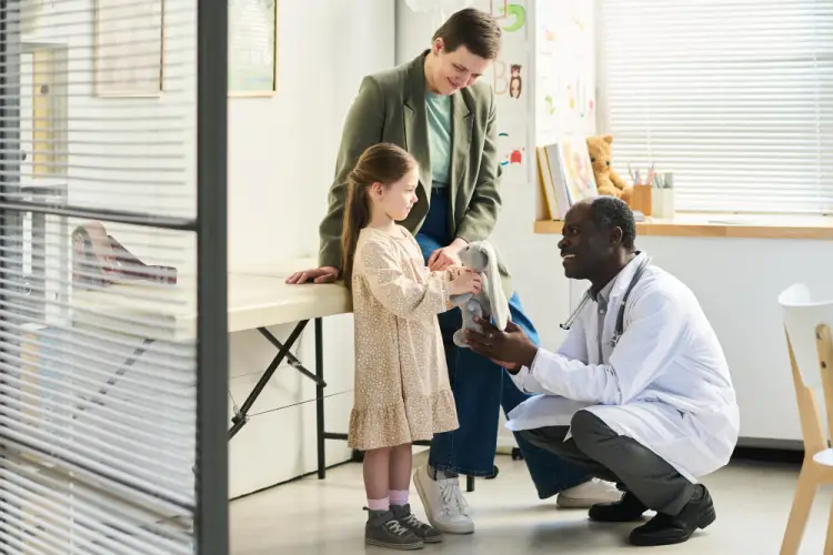 doctor-interacting-with-child-in-clinic.jpg