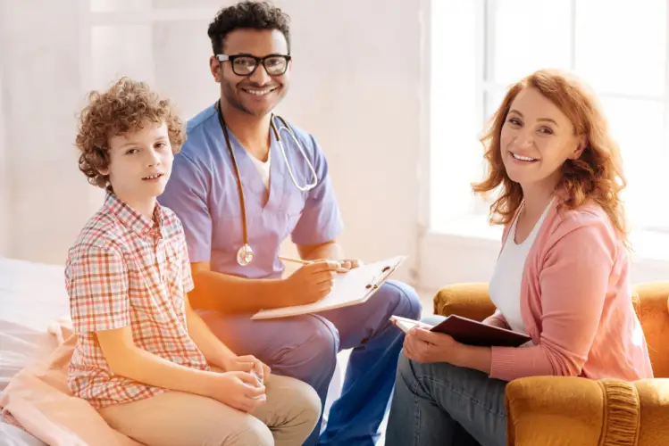 happy-mother-and-son-with-family-doctor.jpg