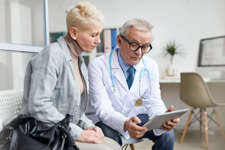 elderly-woman-consulting-general-practitioner.jpg