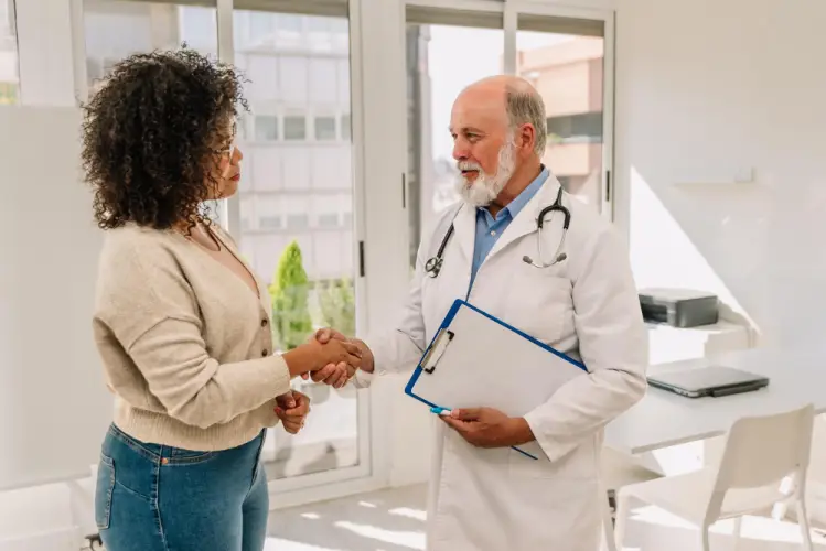 doctor-greeting-patient-in-clinic.jpg