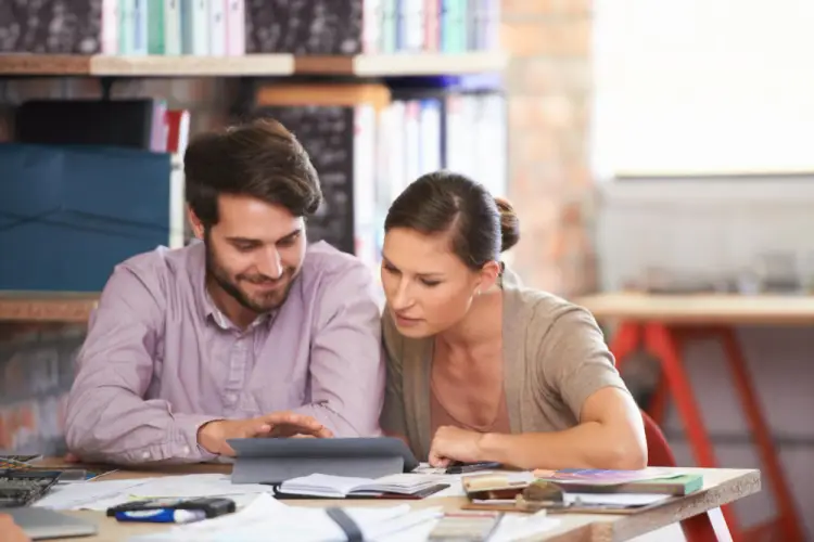 students-discussing-project-tablet.jpg