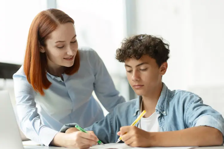 teacher-helping-student-study.jpg