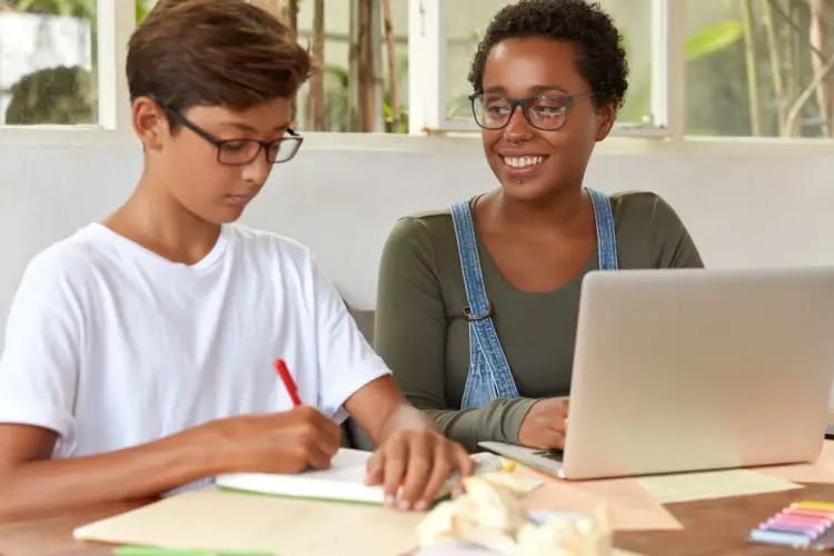 private-tutor-helping-boy-homework.jpg