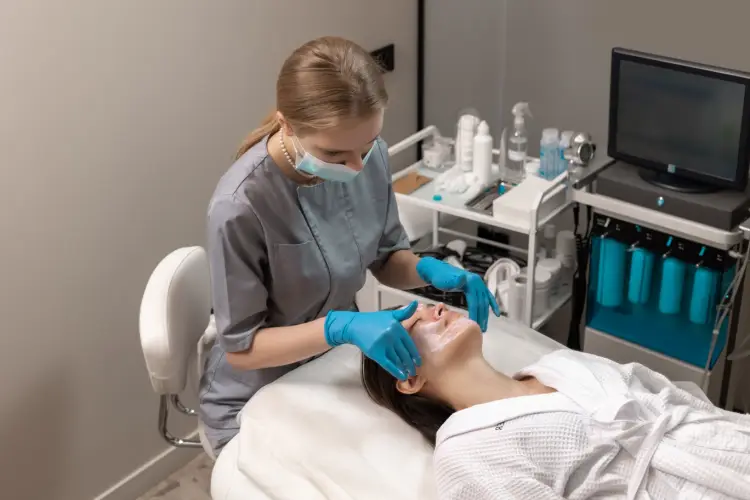 woman-receiving-face-treatment-by-cosmetologyst-beauty-salon.jpg
