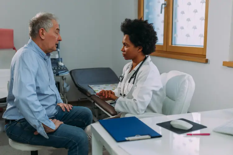 female-doctor-consulting-elderly-woman-in-lobby.jpg