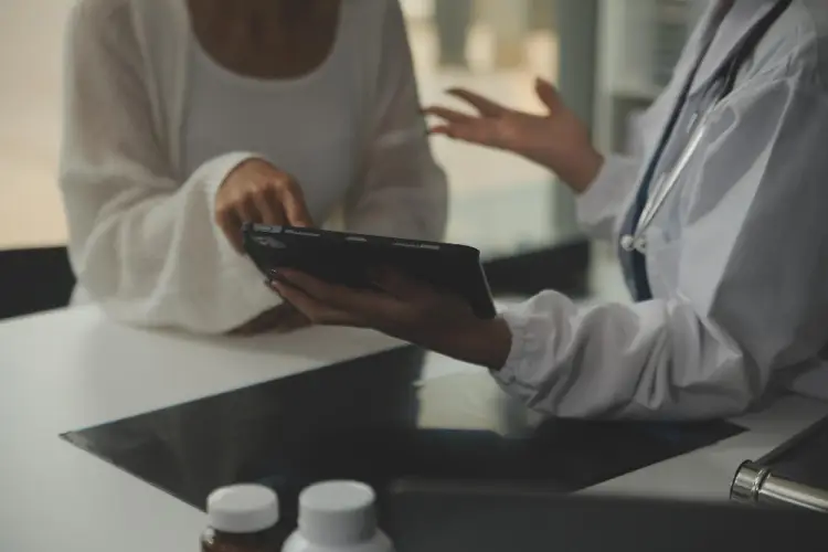 doctor-discussing-results-with-patient-tablet.jpg