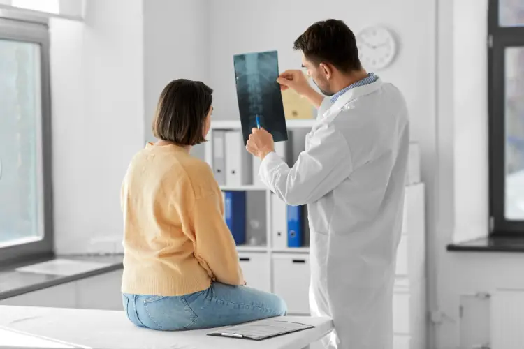 doctor-discussing-spinal-xray-with-female-patient.jpg