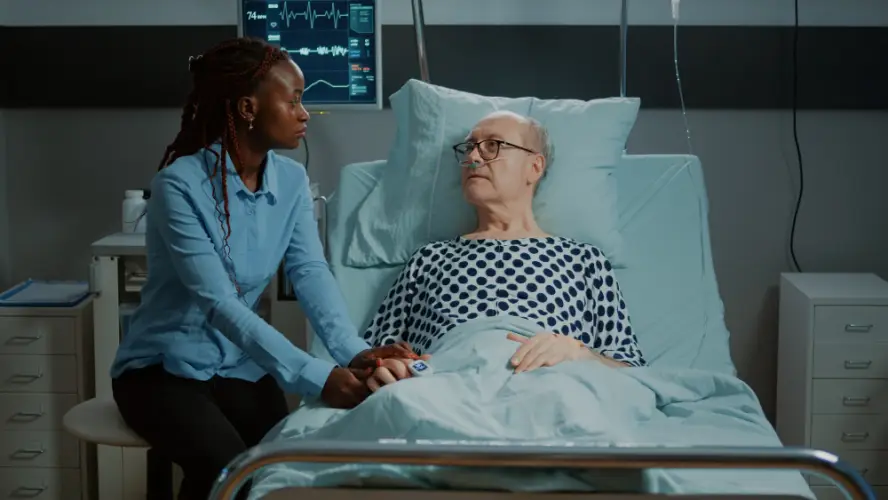 hospital-visit-family-member-comforting-elderly-man.jpg