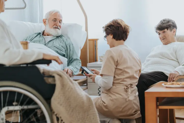 elderly-patient-being-visited-by-family-in-hospital.jpg