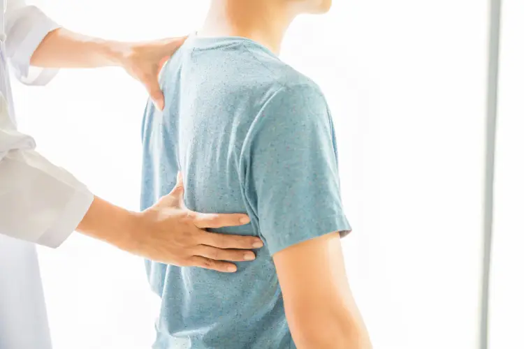 male-patient-upper-back-exam.jpg