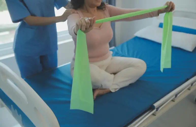patient-doing-shoulder-rehab-exercise-band.jpg