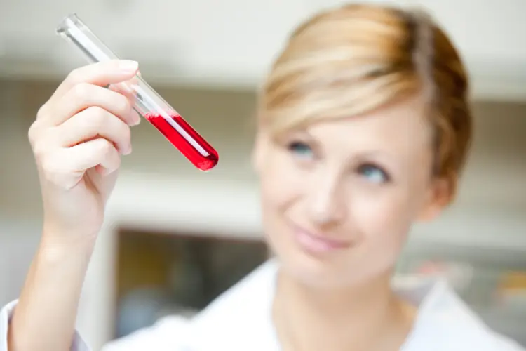 technician-holding-blood-test-tube.jpg