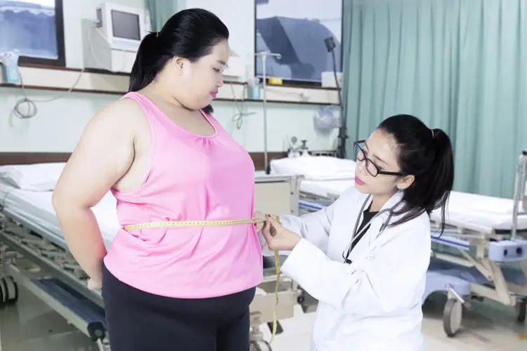 doctor-checking-belly-obese-woman.jpg