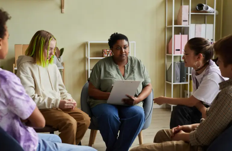 teen-group-therapy-session-with-therapist.jpg
