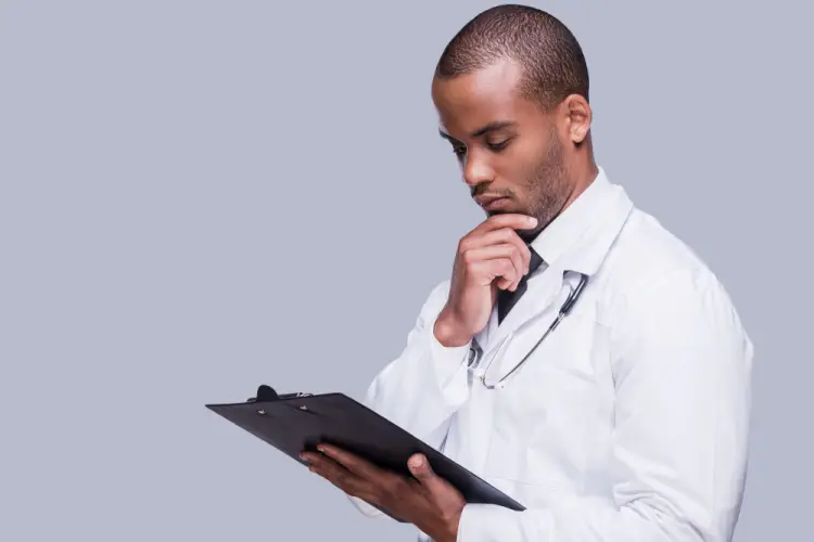 doctor-reviewing-medical-report-clipboard.jpg