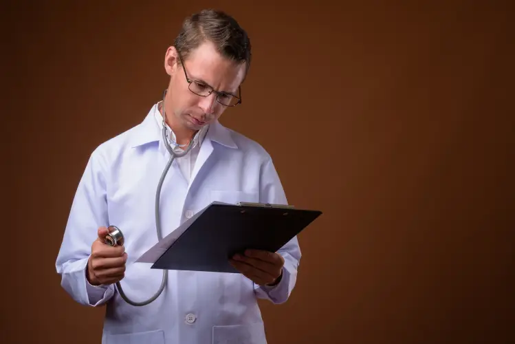 man-doctor-against-brown-wall.jpg