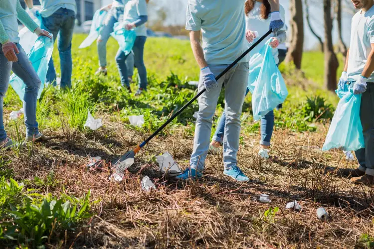 volunteering-people-ecology-concept-group-happy-volunteers-with-garbage-bags-rack-cleaning-area-park.jpg