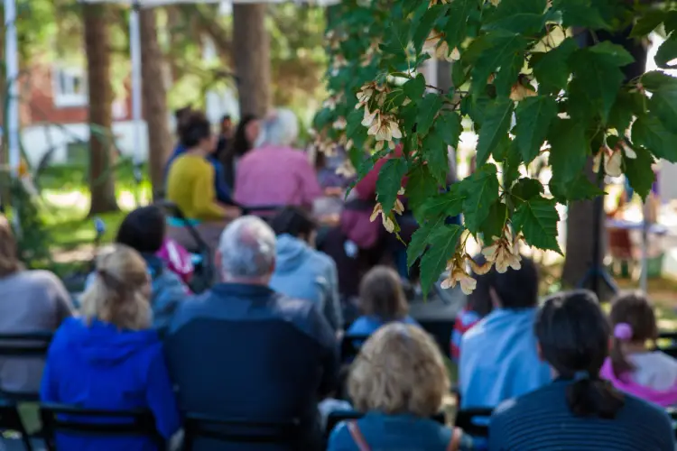 outdoor-community-gathering-under-trees.jpg