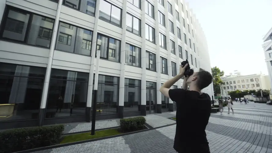 photographer-takes-pictures-citys-modern-architecture-action-young-man-shoots-modern-architecture.jpg