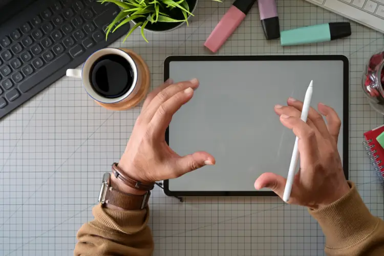 digital-artist-gesturing-over-tablet-with-stylus.jpg