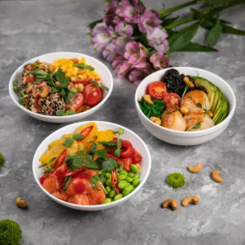 trio-of-poke-bowls-with-fresh-ingredients-and-cashews.jpg